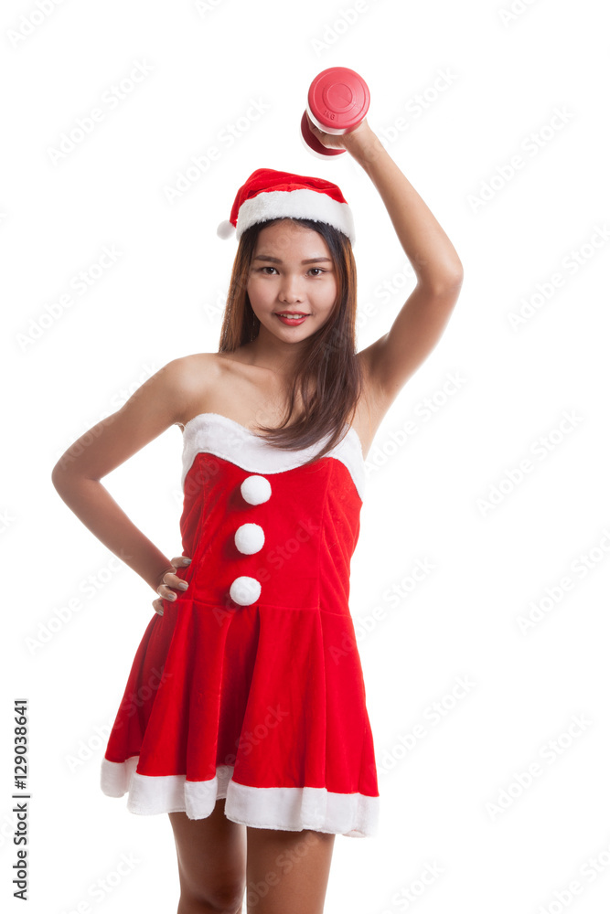 Asian Christmas girl with Santa Claus clothes and red dumbbell. Asian Christmas girl with Santa Claus clothes and red dumbbell.