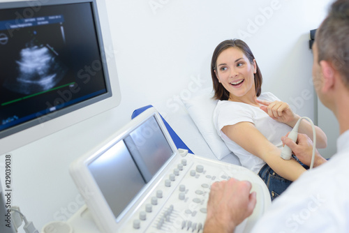 pregnant woman checking her echography photo