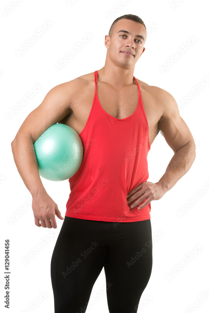 Fit Man Standing Holding a Pilates Ball Fit Man Standing Holding a Pilates Ball
