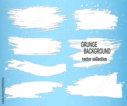 White brush strokes on a blue background, ink brush strokes, brushes, lines. Dirty artistic design elements, boxes, frames