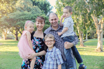 Happy family of five in the park