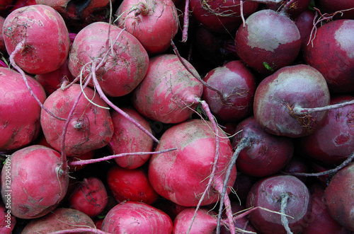 Red and purple  beets piled for market close-up
