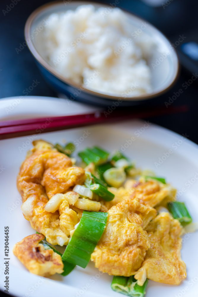 Thai style omelet mixed with Japanese onion bunch serve with Japanese rice Thai style omelet mixed with Japanese onion bunch serve with Japanese rice