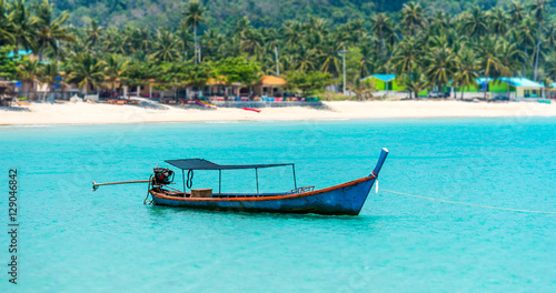tilt shift of fishing boat in the blue sea at coast of  Thailand © viiwee