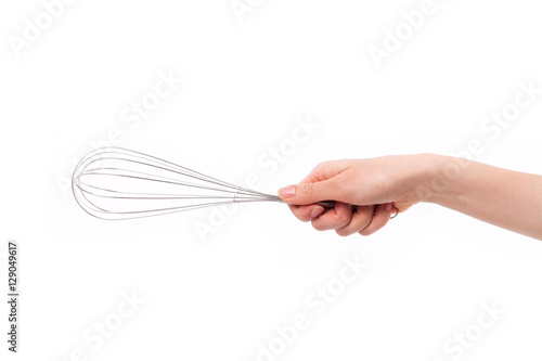 baker or chef hand holding whisker, kitchen utensil