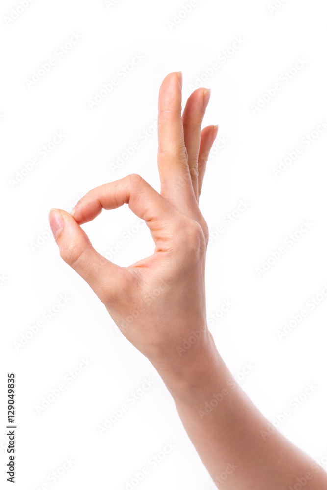 woman hand pointing up okay, yes, accepting hand sign to the side, studio isolated woman hand pointing up okay, yes, accepting hand sign to the side, studio isolated