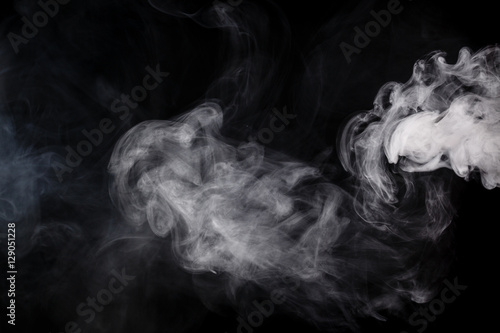 Abstract smoke Weipa. Personal vaporisers fragrant steam. The concept of alternative non-nicotine smoking. Smoke on a black background. E-cigarette. Evaporator. Taking Close-up. Veyping.