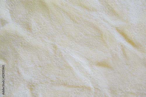 fiber fabric texture background in cream color tone. fabric uneven