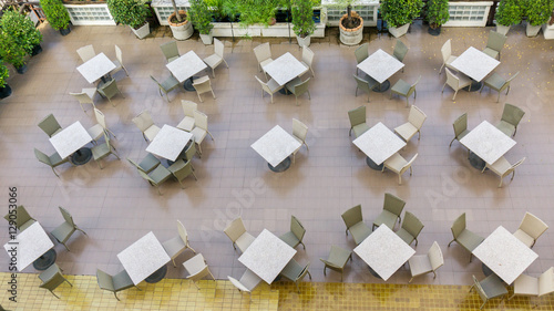 Outdoor top view of the empty chairs and table photo