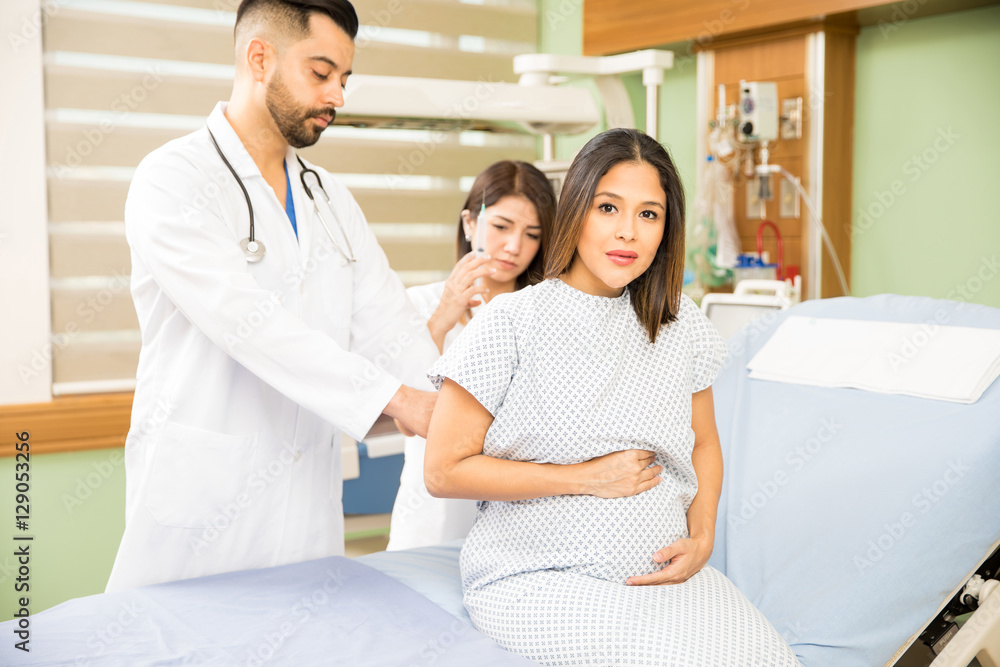Worried pregnant woman in a hospital Worried pregnant woman in a hospital