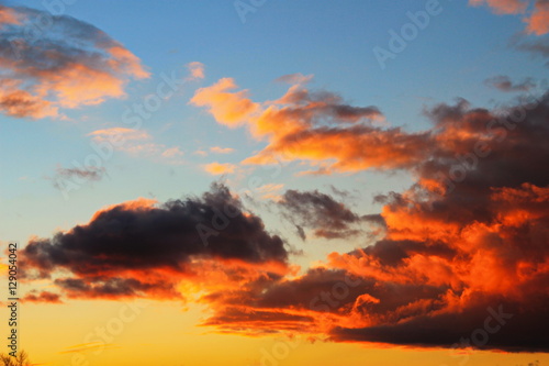 Beautiful bright clouds in the sunset sky 
