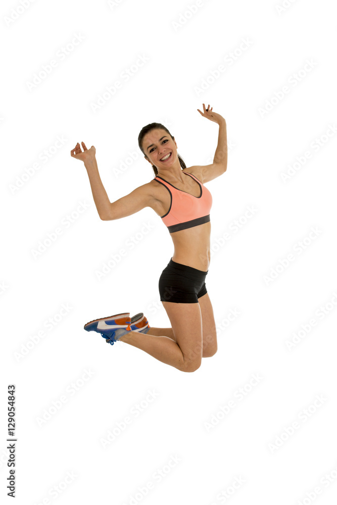 young attractive fitness trainer woman jumping high excited and happy