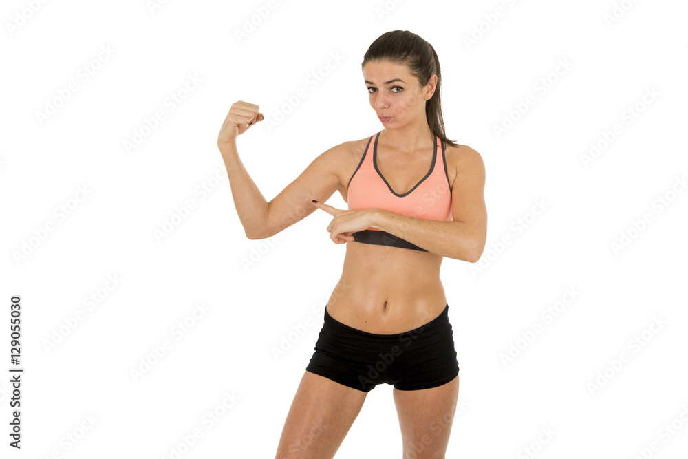 young attractive sport woman in fitness clothes smiling happy showing biceps posing isolated young attractive sport woman in fitness clothes smiling happy showing biceps posing isolated