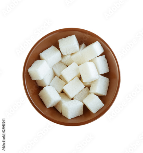 White sugar cubes in bowl on white background