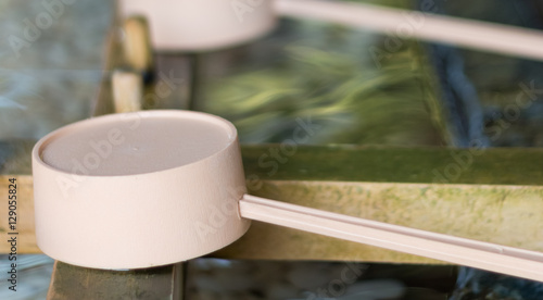 Purification ladles at basin outside shinto shrine in Sapporo