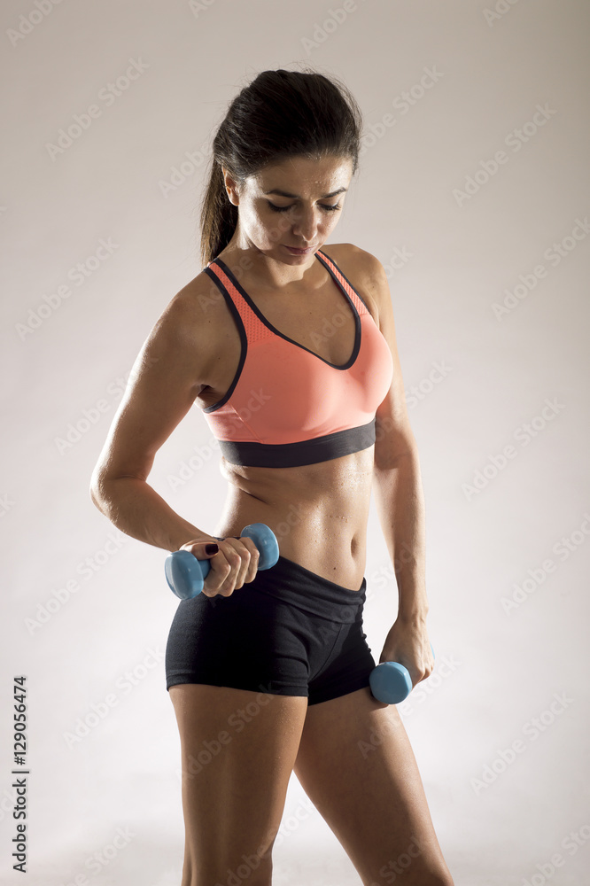 Obraz premium attractive sport woman in fitness clothes smiling happy in aerobics training workout posing sexy