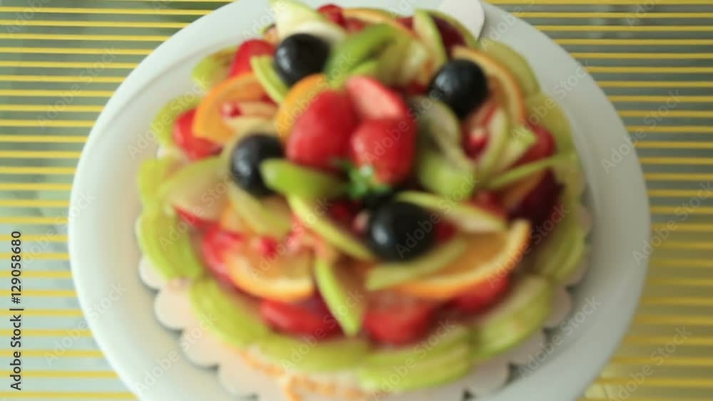 Fresh dessert fruit tart covered in assorted fruits Fresh dessert fruit tart covered in assorted fruits
