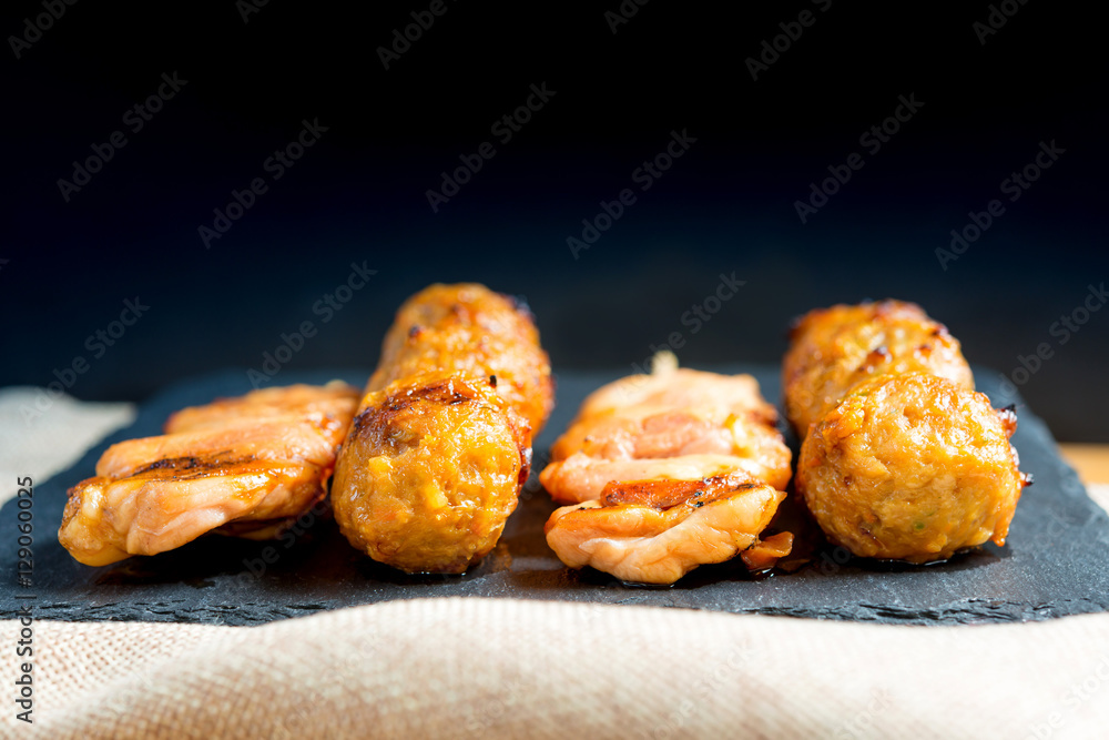 Fototapeta premium tasty kabobs with vegetables on a slate plate