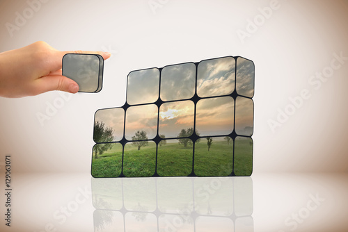 sustainable growth concept: hand and cubes