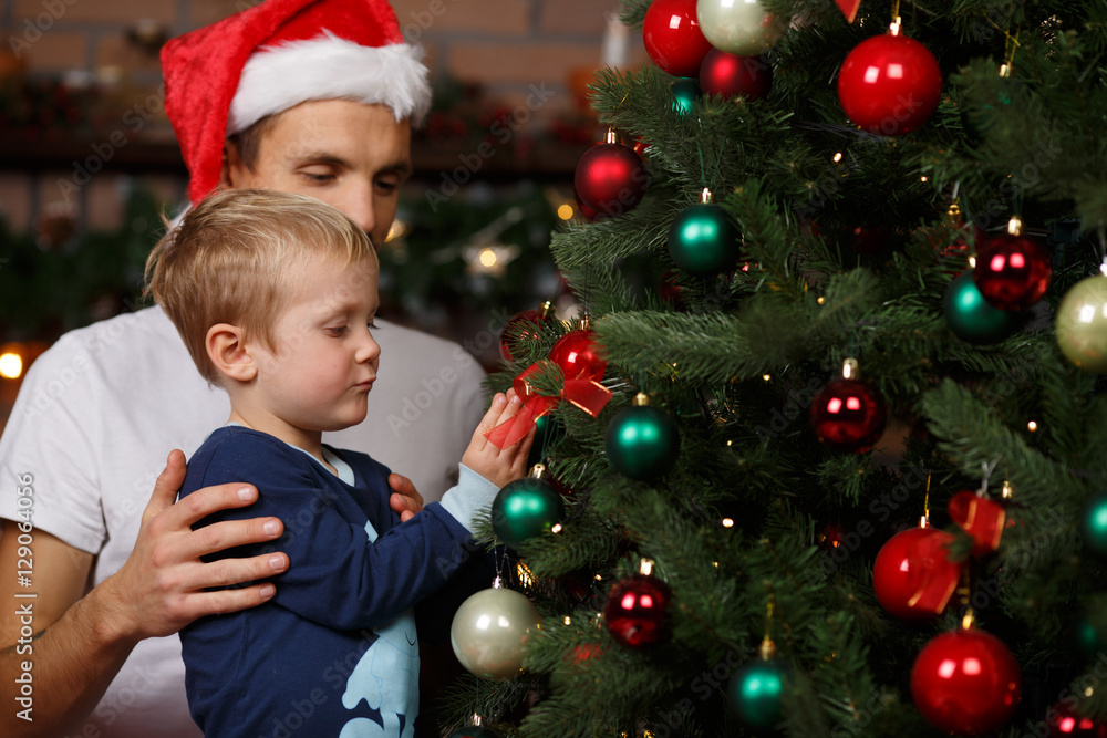 Happy father, son near tree Happy father, son near tree