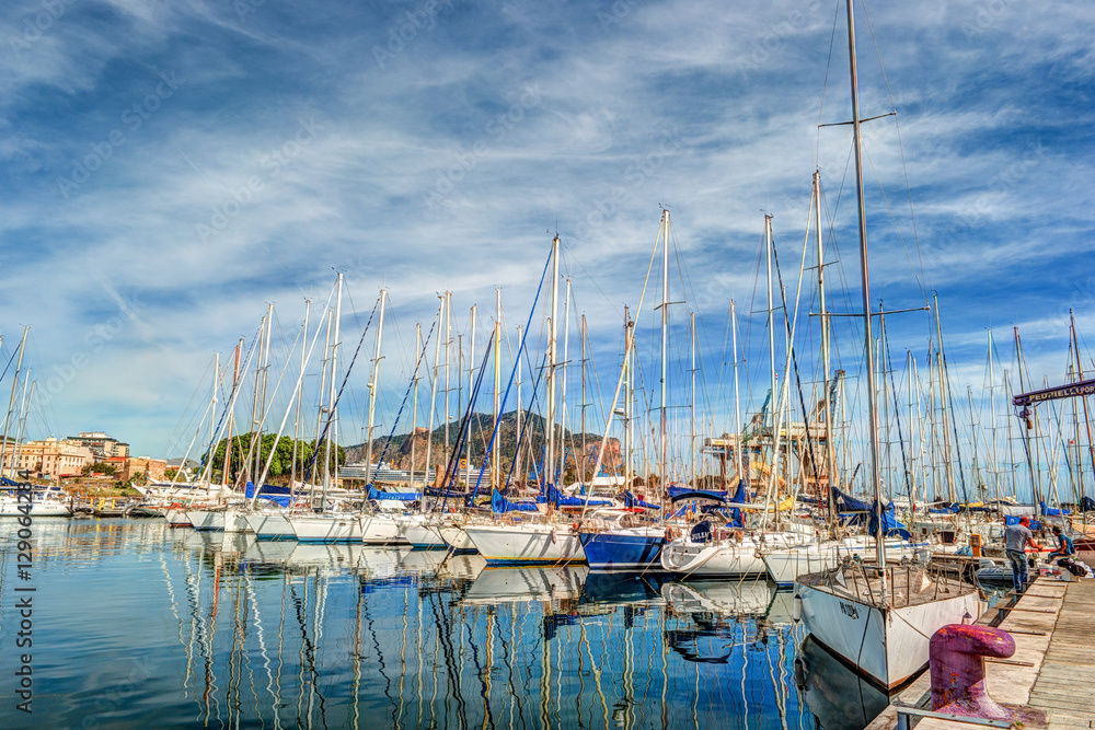 Boats and yachts parked in La Cala bay, old port in Palermo, Sicily, Italy.