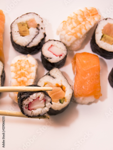 Pieces of sushi on white background
