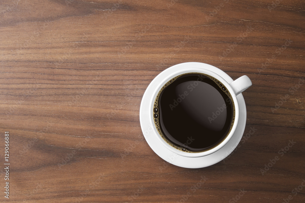white coffee cup and hot espresso coffee on wooden table. top view white coffee cup and hot espresso coffee on wooden table. top view
