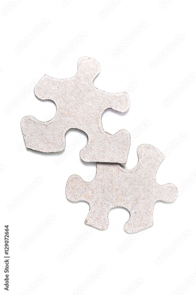 Obraz premium Two puzzle pieces isolated on white background
