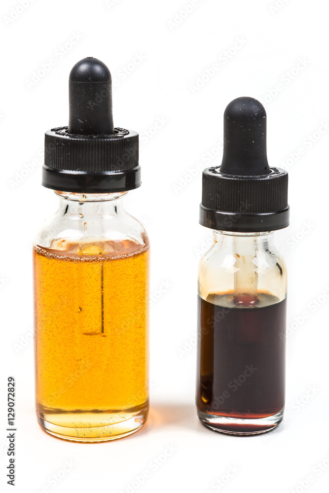 Fresh and expired discolored vape juice isolated on white background