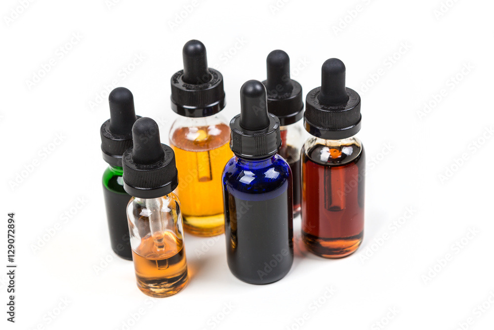 Assorted flavors of vape juice isolated on white background Assorted flavors of vape juice isolated on white background