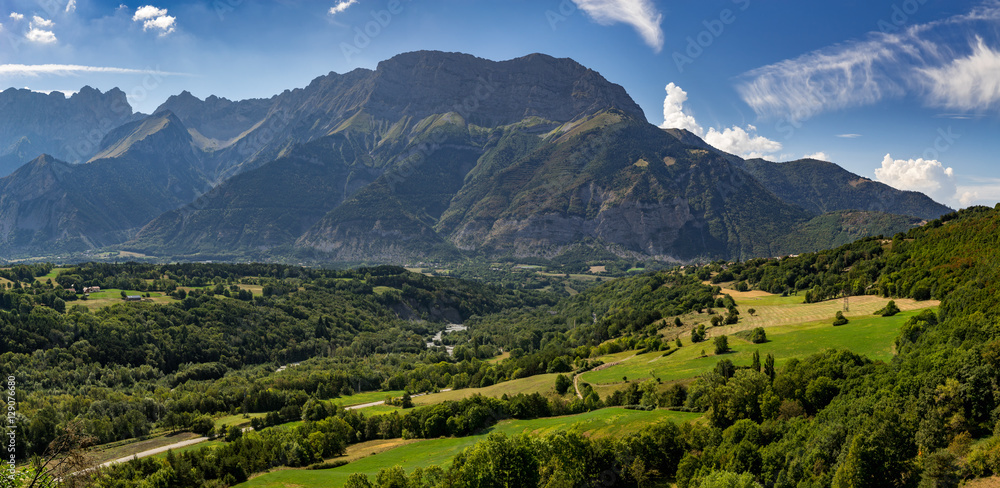 Obraz premium Summer afternoon view of the Devoluy Massif range with Faraut mountain and Pierroux Peak. Hautes Alpes, Southern French Alps, France