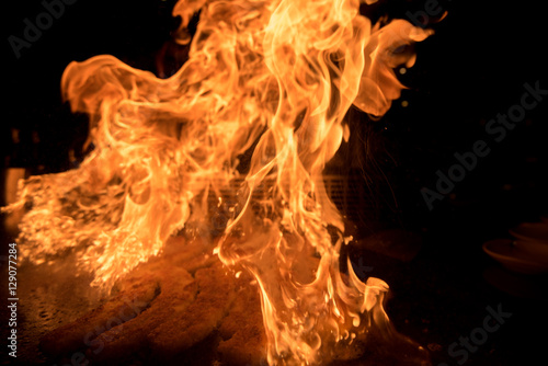 Chef flambing bananas