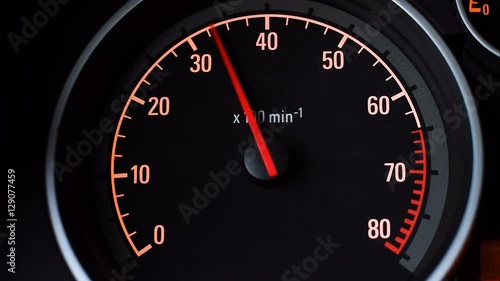 Car tachometer and moving pointer on it.