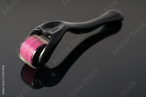 Derma roller for medical micro needling therapy. Tool also known as: Derma roller, mesoroller, meso-roller, mesopen. photo