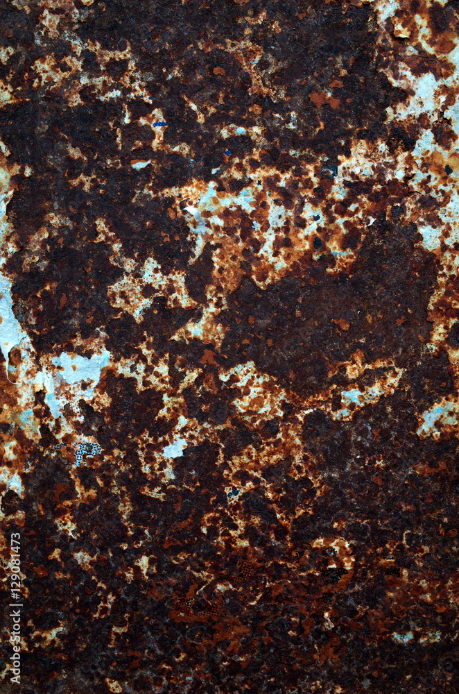 Background of rusted metal and torn paper left behind on a billboard Background of rusted metal and torn paper left behind on a billboard