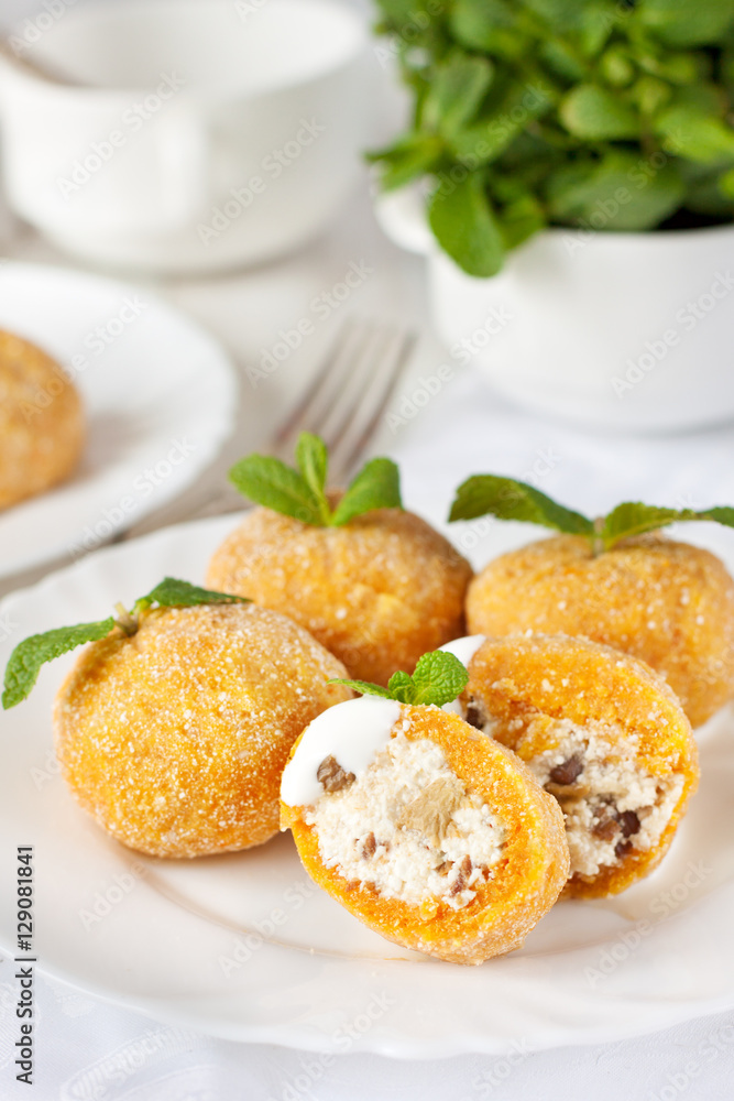 Pumpkin dumplings (knodel) filled with cottage cheese