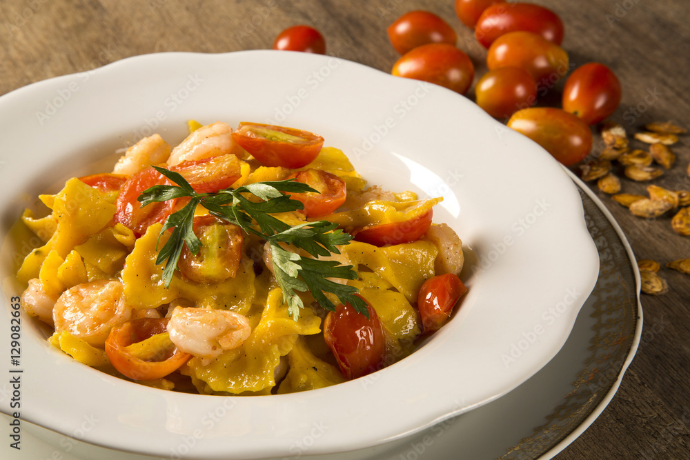 Pumpkin farfalle with shrimp and cherry tomato Pumpkin farfalle with shrimp and cherry tomato