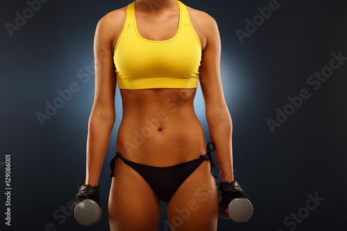 Woman lifting dumbells