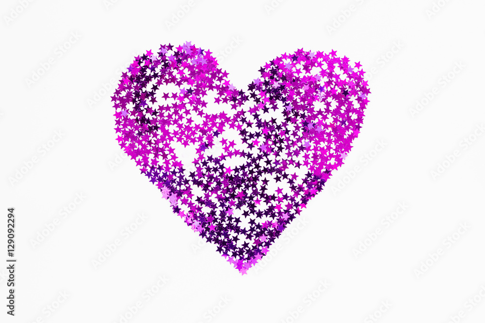 Heart made of sparkling magenta purple conffetti. Shining symbol of love on white background.