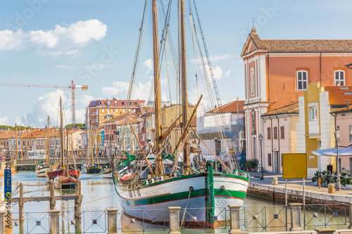 Fotografie Antique fishing boats in harbor channel