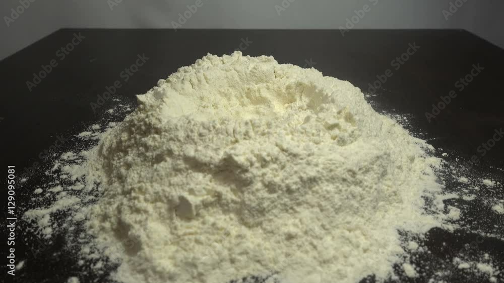 Egg dropping into flour, slow motion HD Egg dropping into flour, slow motion HD