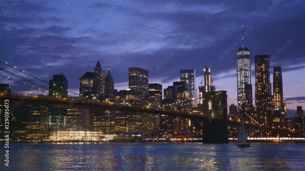 View of Brooklyn Bridge with the distinctive New York skyline in background at sunset, New York , United States View of Brooklyn Bridge with the distinctive New York skyline in background at sunset, New York , United States