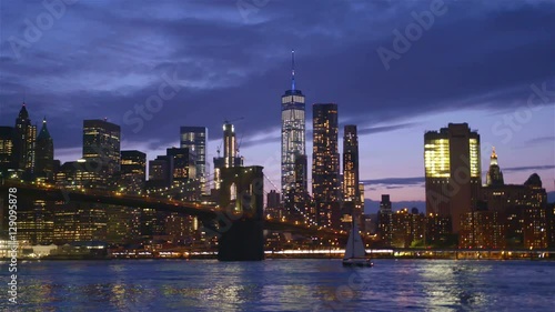 View of Brooklyn Bridge with the distinctive New York skyline in background at sunset, New York , United States