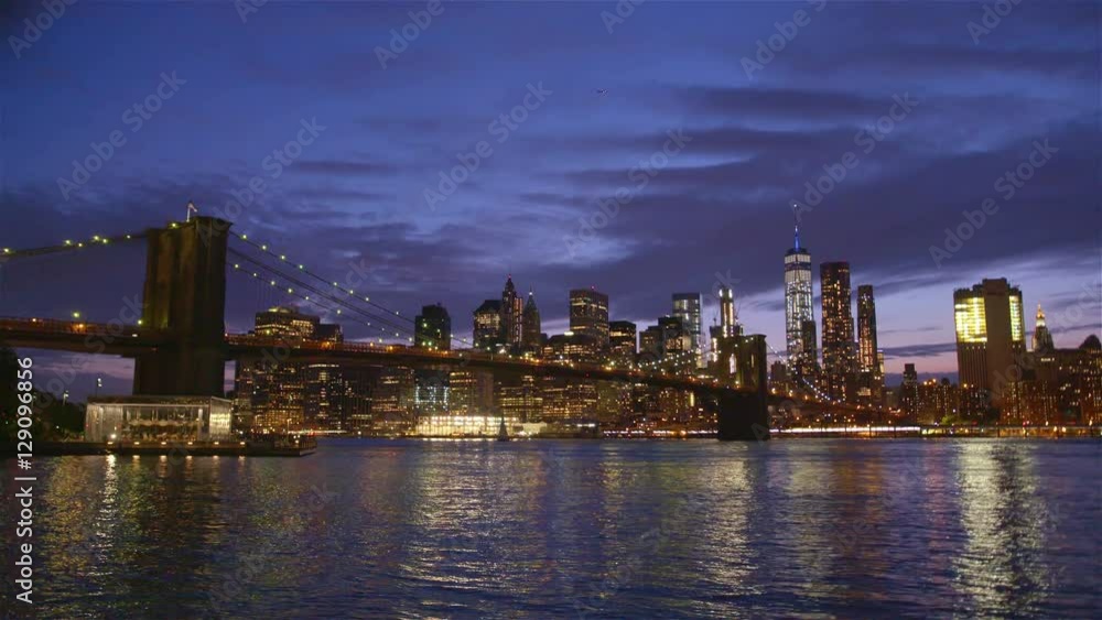 View of Brooklyn Bridge with the distinctive New York skyline in background at sunset, New York , United States View of Brooklyn Bridge with the distinctive New York skyline in background at sunset, New York , United States