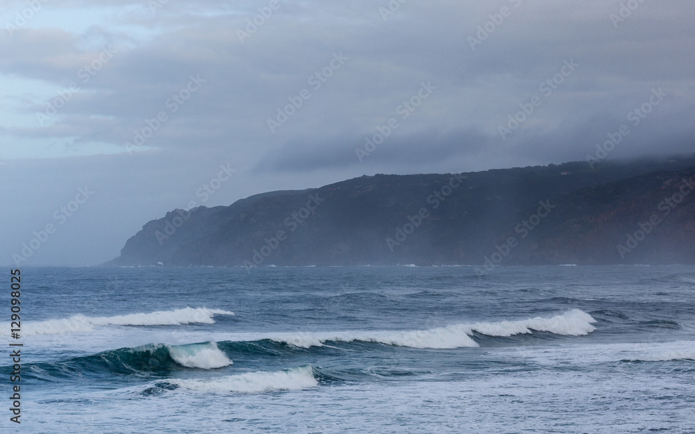 Autumn foggy day on the shores of the Atlantic Ocean in Sintra, Portugal