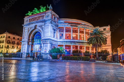 Night view of the Politeama Garibaldi theater in Palermo, Sicily, Italy.