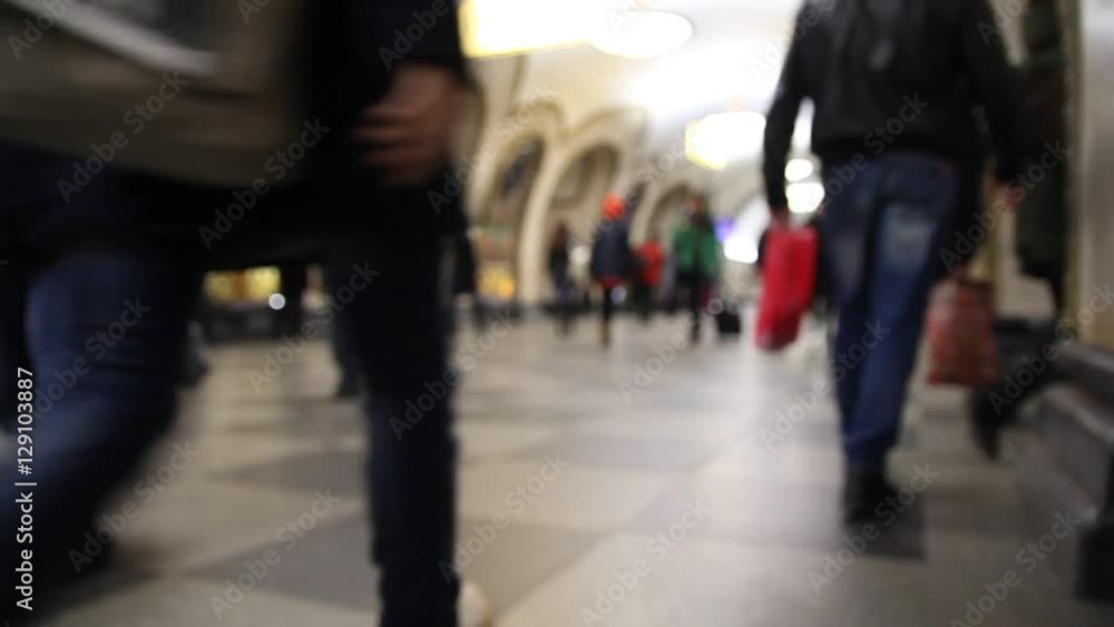 people in the subway walking home from work, blurry, bottom view, shoes and the crowd people in the subway walking home from work, blurry, bottom view, shoes and the crowd