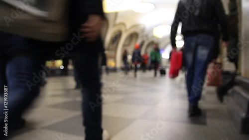 Wallpaper Mural people in the subway walking home from work, blurry, bottom view, shoes and the crowd Torontodigital.ca