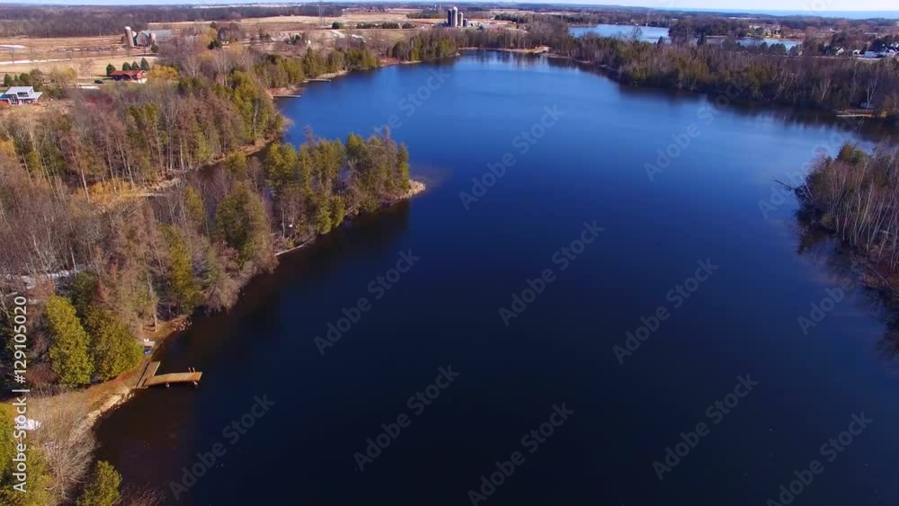 Landscape of lakes and farms as far as the eye can see.

