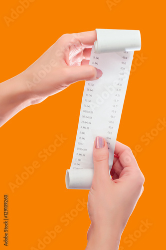 Woman Hold in Her Hands Roll of Paper With Printed Receipt Mock Up Template. Only Digits Are Shown on Mockup. May Be Used in Article About Shopping, Paying Bills and Finance. Copy Space Clipping Path.